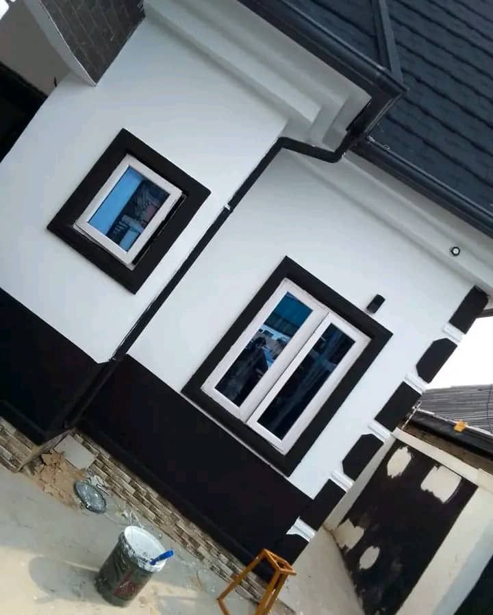 a fine painted house with a dark shade of black and white
